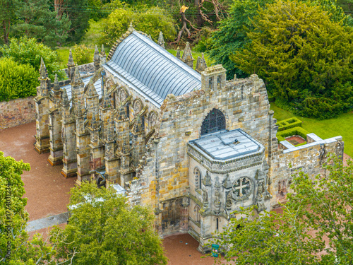 Aerial view of Rosslyn Chapel, it was founded in 1446 by Sir William St Clair. Rural Midlothian. Da Vinci Code movie. Ley lines and rose line. Edinburgh. Scotland. UK