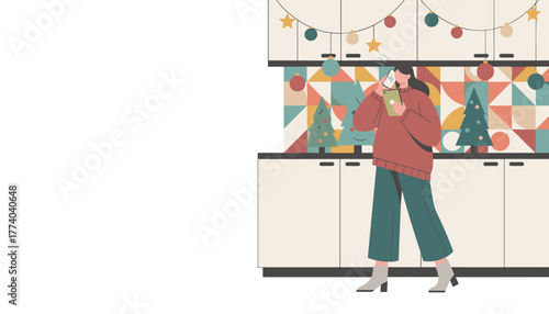 Woman on phone holding tablet in modern holiday decorated kitchen Digital Christmas communication