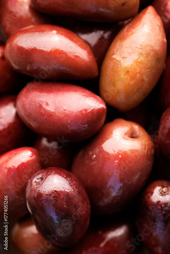 Kalamata olives with a stone, macro. Olives background photography