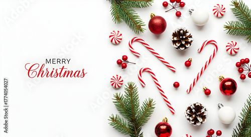Christmas composition with candy canes pine branches red ornaments and Merry Christmas text on white background