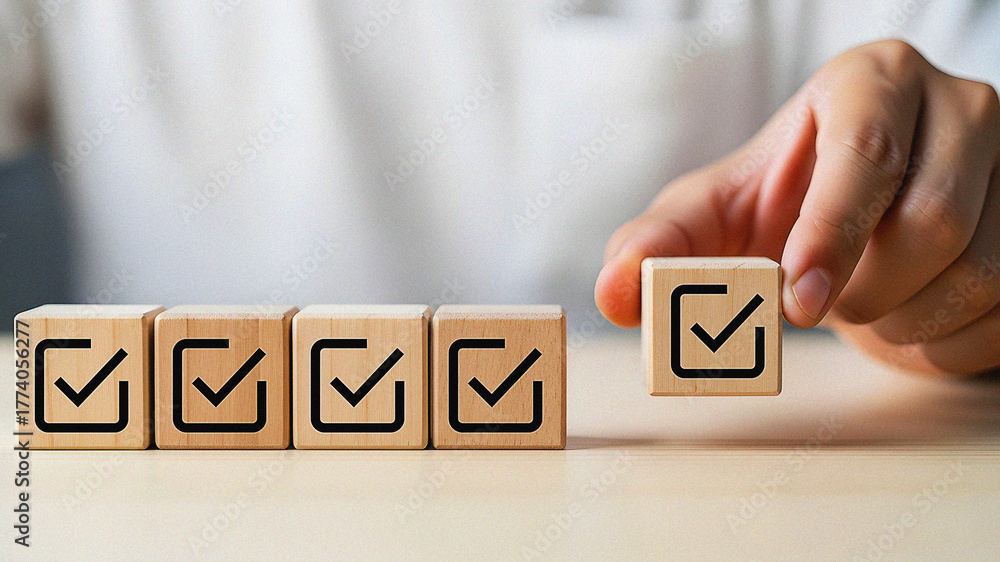 Naklejka premium Successful Completion and Quality Assurance Checklist Concept for Business Hand Placing the Final Wooden Block with a Checkmark Icon for Task Done