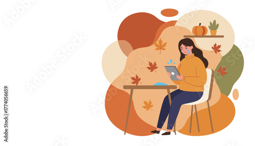 Crying woman looks at a tablet in an autumn setting representing seasonal affective disorder or loneliness