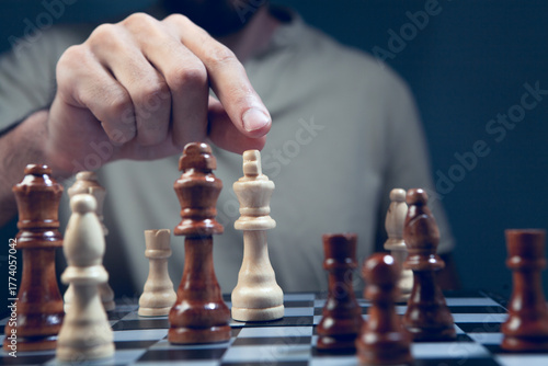 Close up of man playing chess, selective focus, shallow depth of field