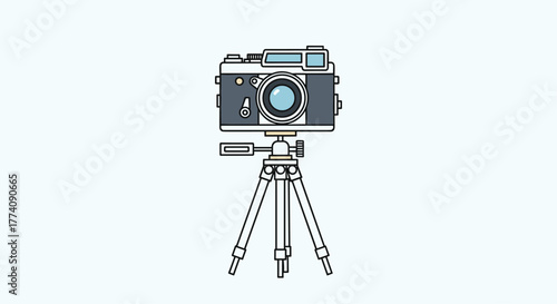 Vintage camera on a tripod ready to capture beautiful moments, ideal for photography blogs and creative projects with a retro vibe