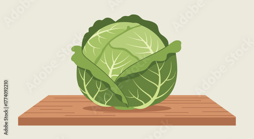 Fresh, vibrant green cabbage rests on a rustic wooden surface, perfect for healthy eating and culinary inspiration