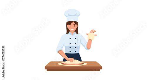 Smiling female chef in uniform expertly kneads dough on a wooden counter, ready to create delicious baked goods