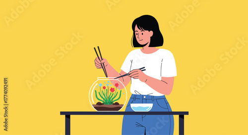 Creative woman carefully arranging miniature garden in fishbowl using chopsticks for a unique DIY project
