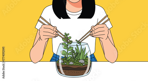 Creative gardener carefully arranging delicate succulents inside a glass terrarium with chopsticks on bright yellow background