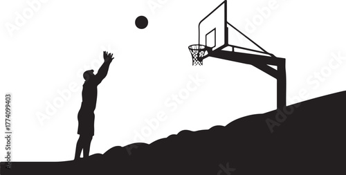 Silhouette of basketball player shooting ball at hoop