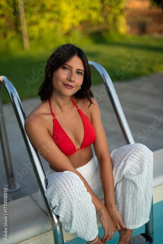 woman in red bikini at pool