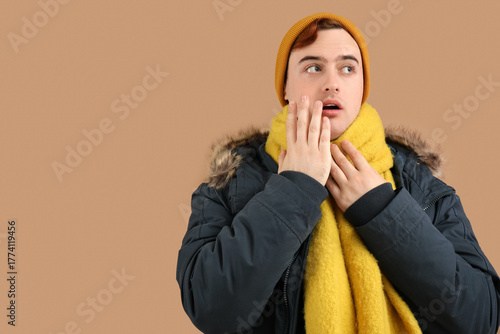 Shocked young man in winter...