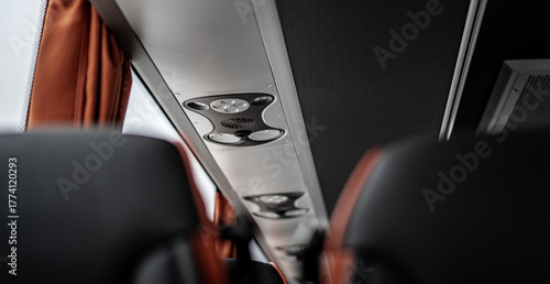 Simple bus interior with clean seats and red design details. Minimal yet functional layout creating a neat, modern, and comfortable atmosphere for everyday travel or transport.