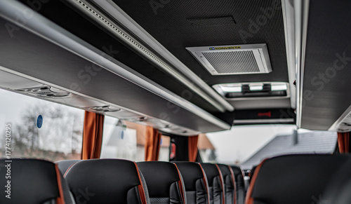Simple bus interior with clean seats and red design details. Minimal yet functional layout creating a neat, modern, and comfortable atmosphere for everyday travel or transport.