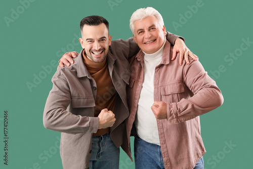 Mature man with his son hug...