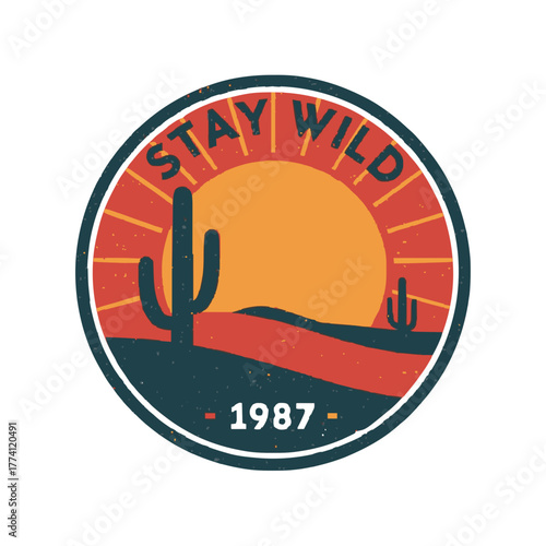 Embrace adventure with this retro desert sunset badge featuring cacti and "Stay Wild"