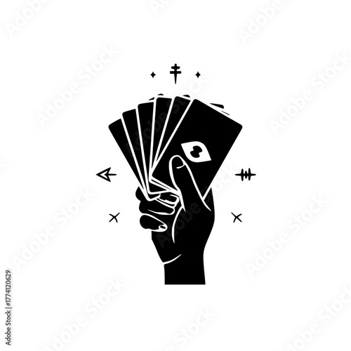 Mysterious hand holding fortune telling cards with mystic symbols radiating