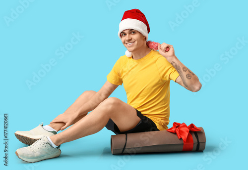 Young happy man in Santa ha...