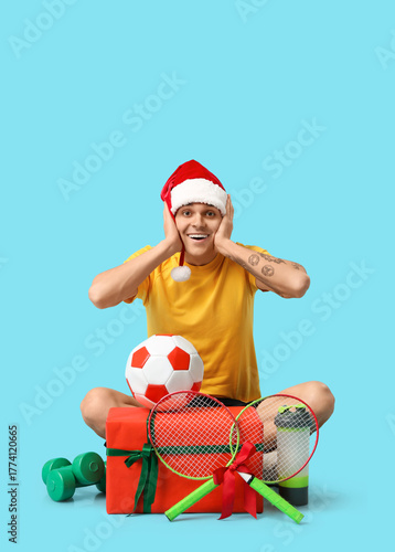 Young happy man in Santa ha...