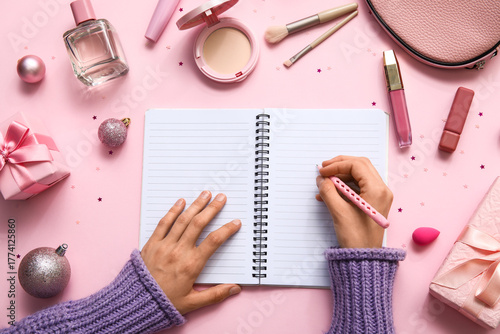 Woman writing in notebook w...