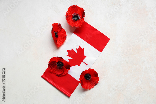 Poppy flowers and flag of C...