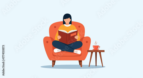 Young woman enjoys quiet time at home, relaxing in a cozy armchair while engrossed in a good book with a warm drink by her side