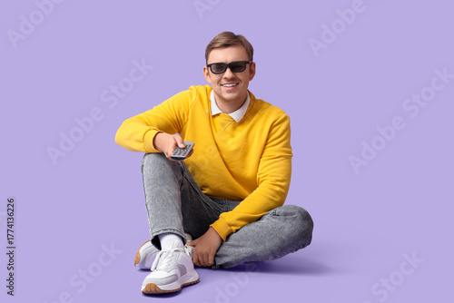 Young man in 3D glasses wit...