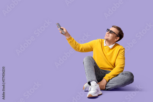 Young man in 3D glasses wit...