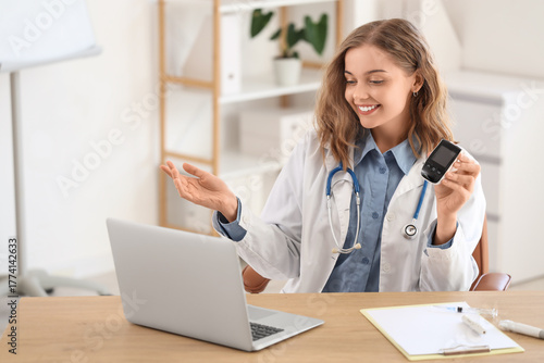 Female doctor with glucomet...