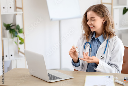 Female doctor with lancet p...