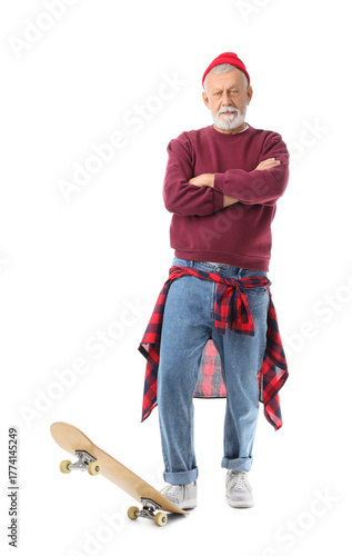 Senior man with skateboard ...
