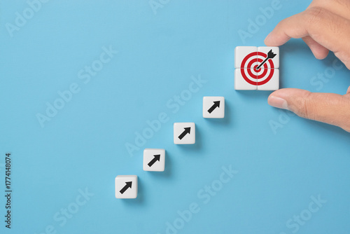Business growth success achievement concept, hand arranging dice stacking as step stair or ladder for planning development leadership and customer target group concept