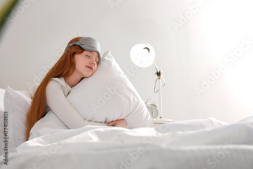 Sleepy girl with sleep mask...
