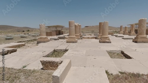 Wallpaper Mural Wide view of Pasargadae’s colonnaded hall: stone columns and bases aligned across the palace floor, excavated grid visible in bright summer light with arid hills on the horizon. Torontodigital.ca
