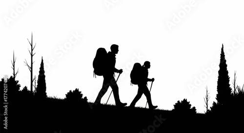 Two hikers with backpacks and trekking poles walking uphill.