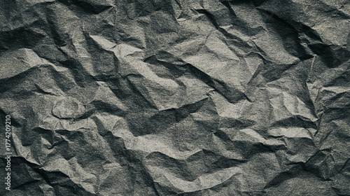 Wallpaper Mural A dark grey crumpled paper texture, providing a distressed, abstract background with shadows. Torontodigital.ca