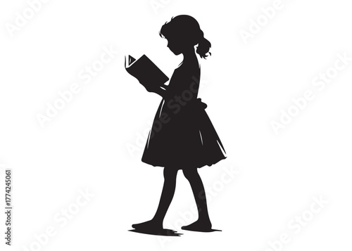 Silhouette of a young girl reading a book