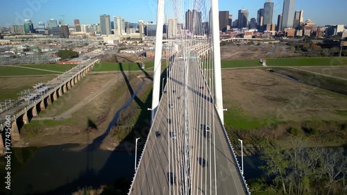 Top down view of Modern Margaret Hunt Hill Bridge over Trinity river in Dallas, Texas during sunny day