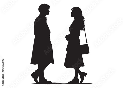 Silhouette of a couple standing and talking