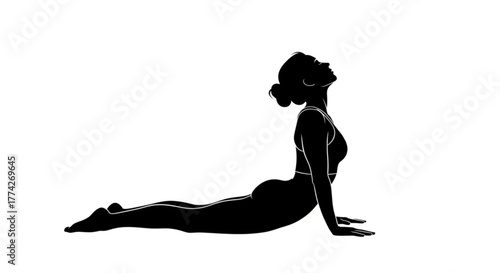 Silhouette of a woman practicing yoga in cobra pose, showcasing flexibility, strength, and mindfulness in fitness and wellness