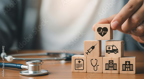 Doctor arranging wooden blocks with medical icons for health insurance and healthcare planning