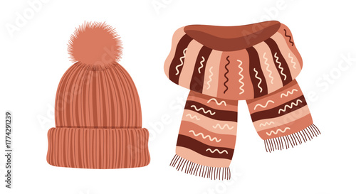 Warm knitted winter hat with a fluffy pom-pom and a striped scarf, essential accessories for chilly autumn and winter days.