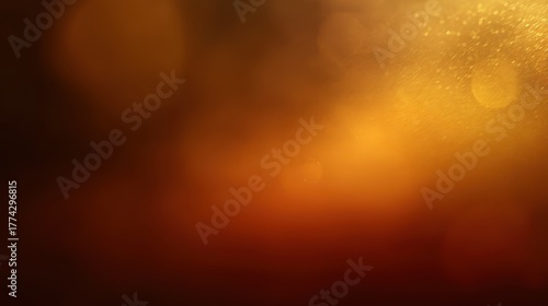 Warm golden-brown abstract background with bokeh lights and subtle texture, a luminous and liquid-like effect, blurred yellow background