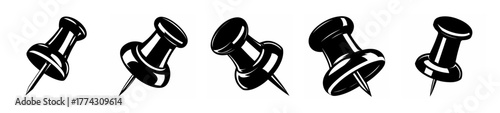 Collection of five black push pins displayed individually against a lighter background surface