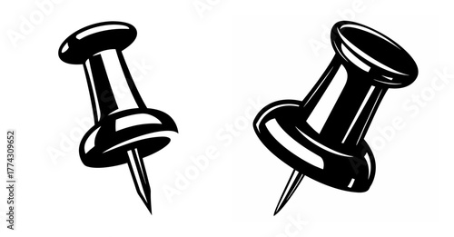 Two glossy black push pins shown isolated on a with sharp metal points facing down