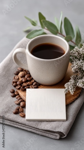 A Stylish Flat Lay Of A Speckled Ceramic Coffee Cup Filled With Dark Coffee Surrounded By Roasted Coffee Beans And A Sprig Of Eucalyptus On A Neutral Textured Background