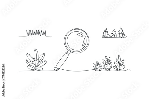 Magnifying glass examining plant life and grass