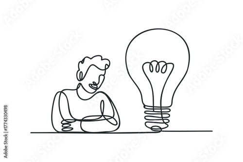 Person contemplating a large illuminated light bulb