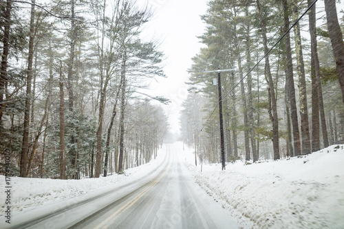 A snowy New Hampshire backroad during a winter storm