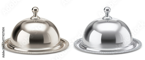 Two polished silver serving dishes, one partially reflecting light, sit against a white backdrop