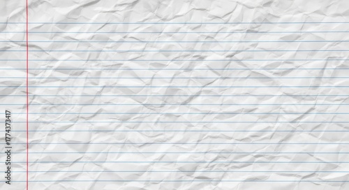 A close-up, high-angle shot of crumpled white lined paper with a red margin line.